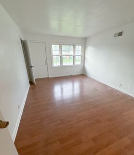 Open concept living room renovation with hardwood floors